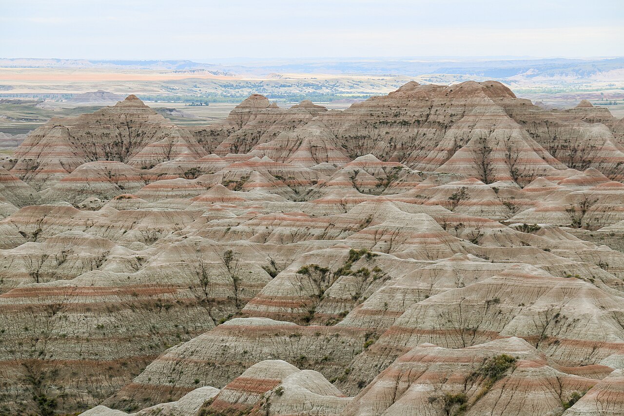 Striped buttes under a prairie sky