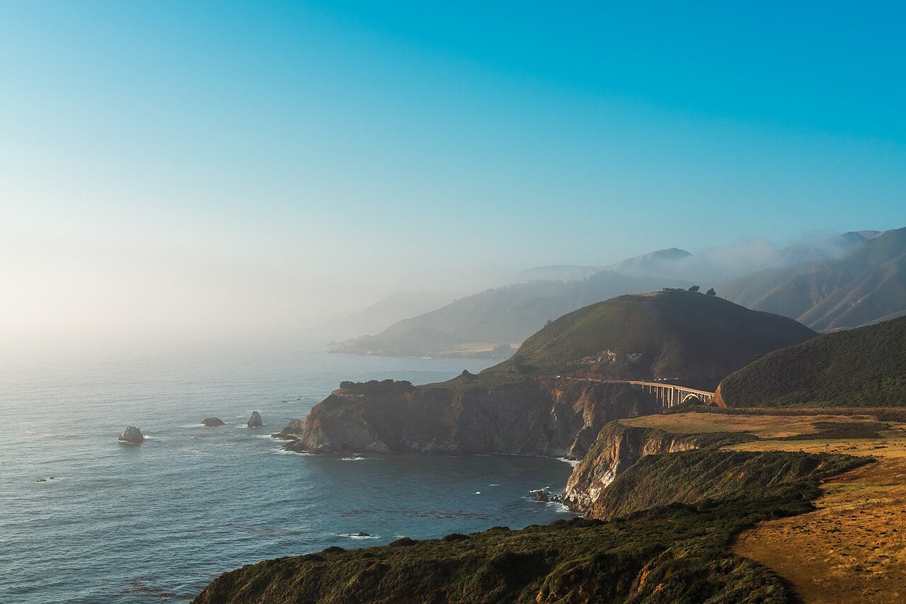 Low sun on tide-cut rock along Big Sur