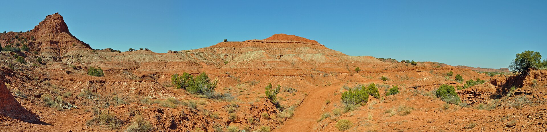 Red Permian walls and a dirt path in Caprock Canyons