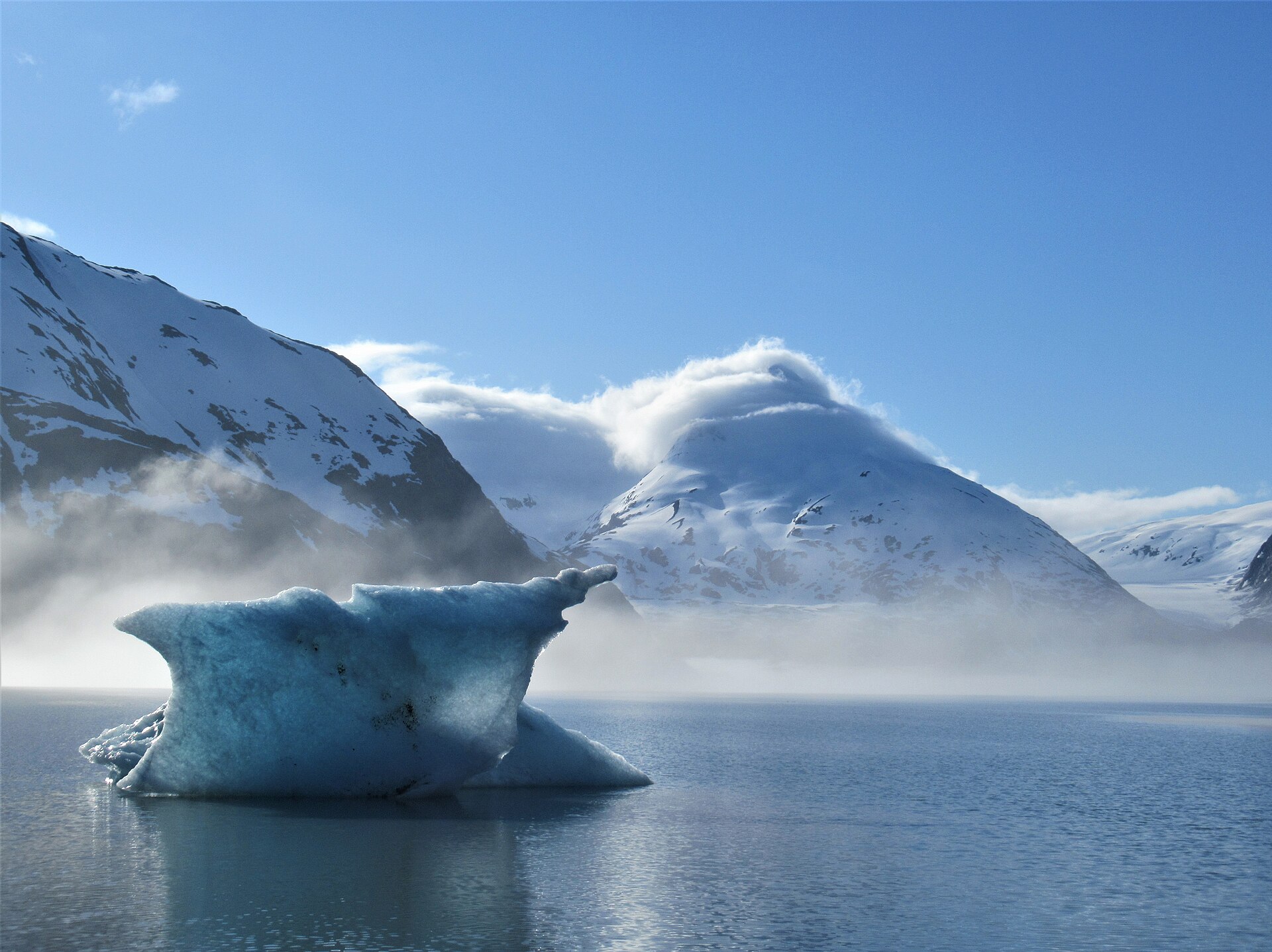 A blue berg under Chugach peaks, Prince William Sound