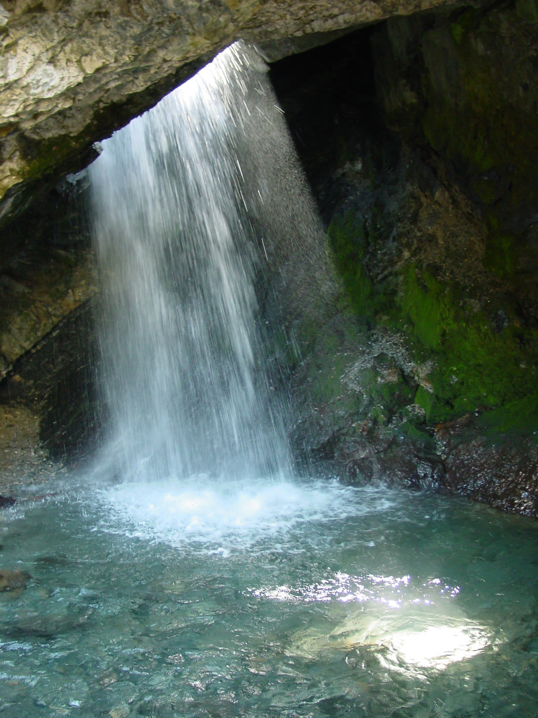 Water falling through the hole in the Donut Falls grotto