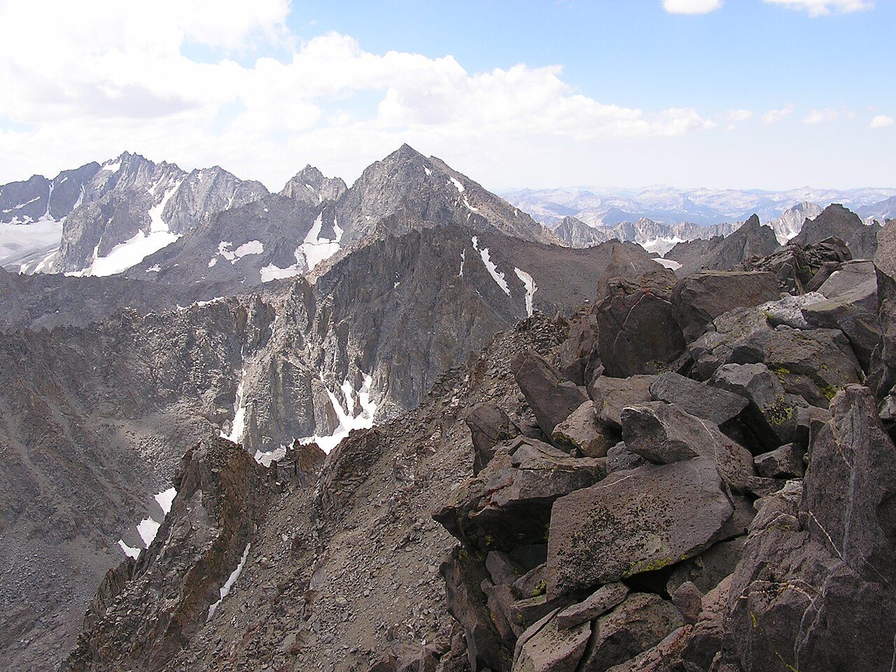 High Sierra lake beneath pale summer peaks