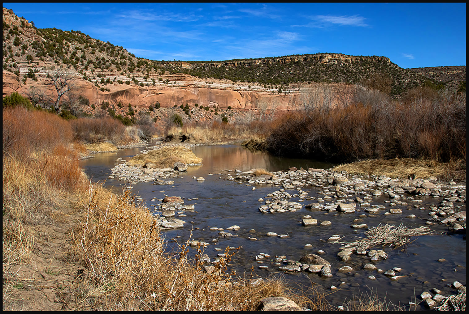 River cobble and red walls in Mills Canyon