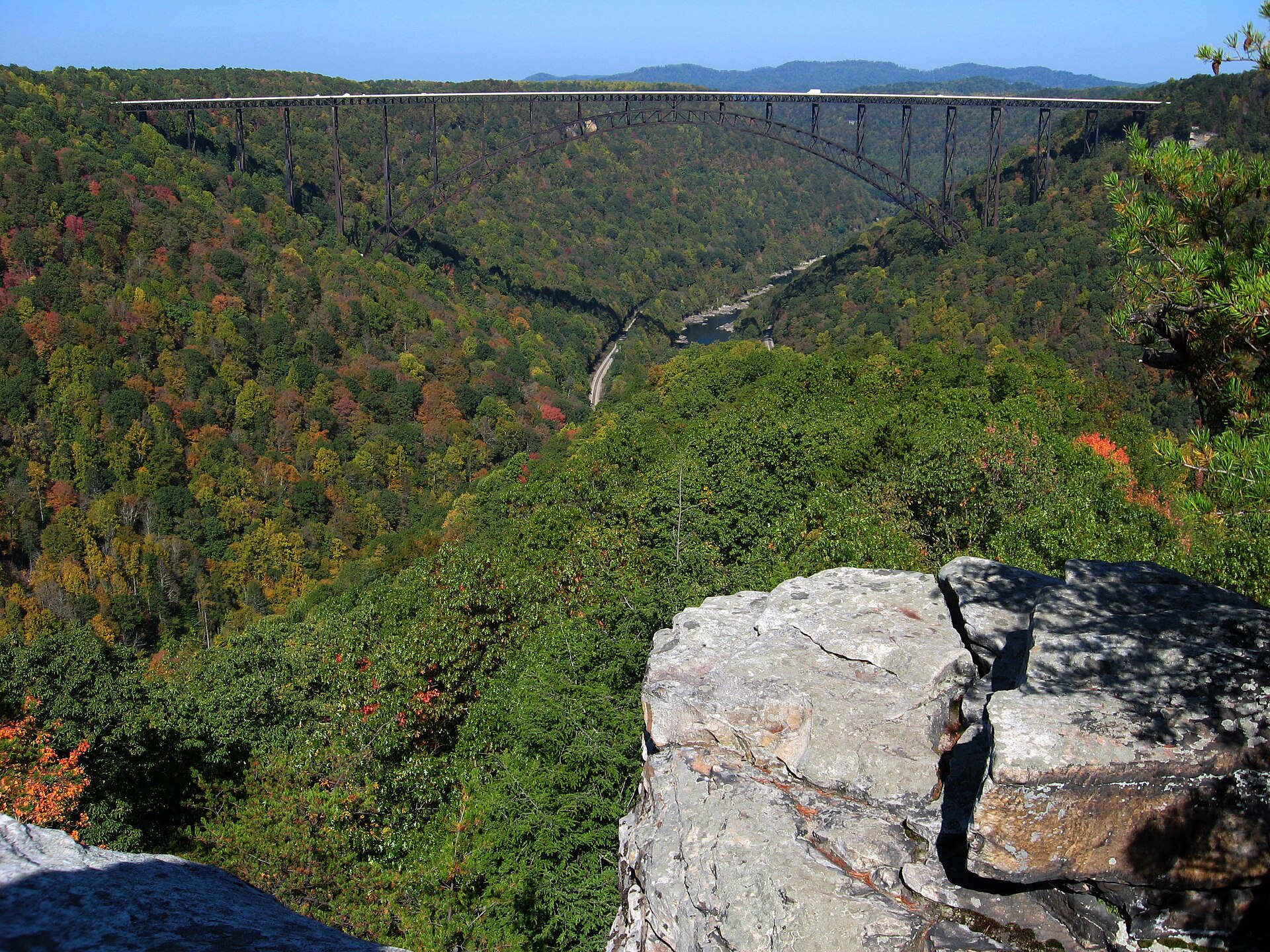 The steel arch over a gorge turning gold and rust