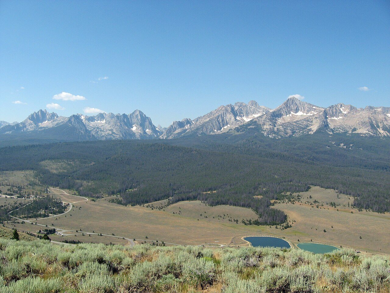 Jagged Sawtooths ring a high granite lake