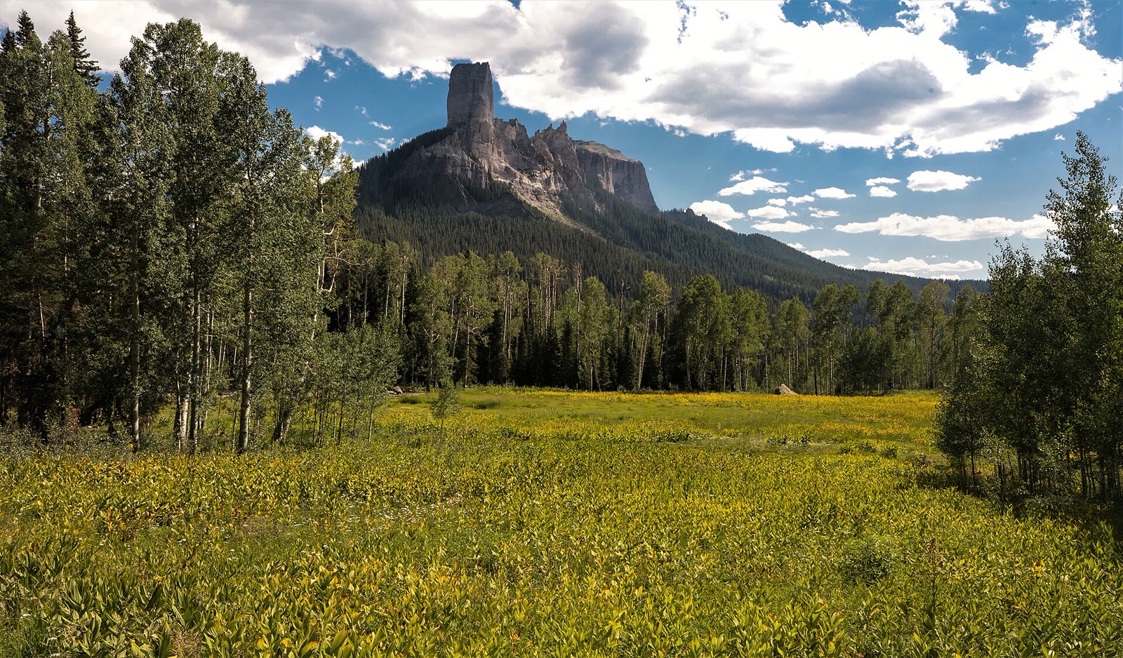 Chimney Rock over an Owl Creek meadow, Silver Jack country