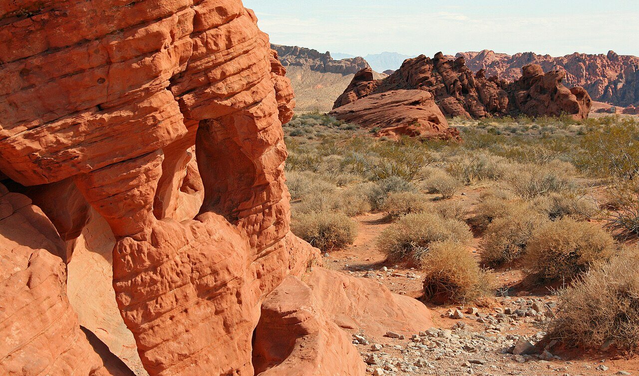 Beehive sandstone domes under a hard blue sky