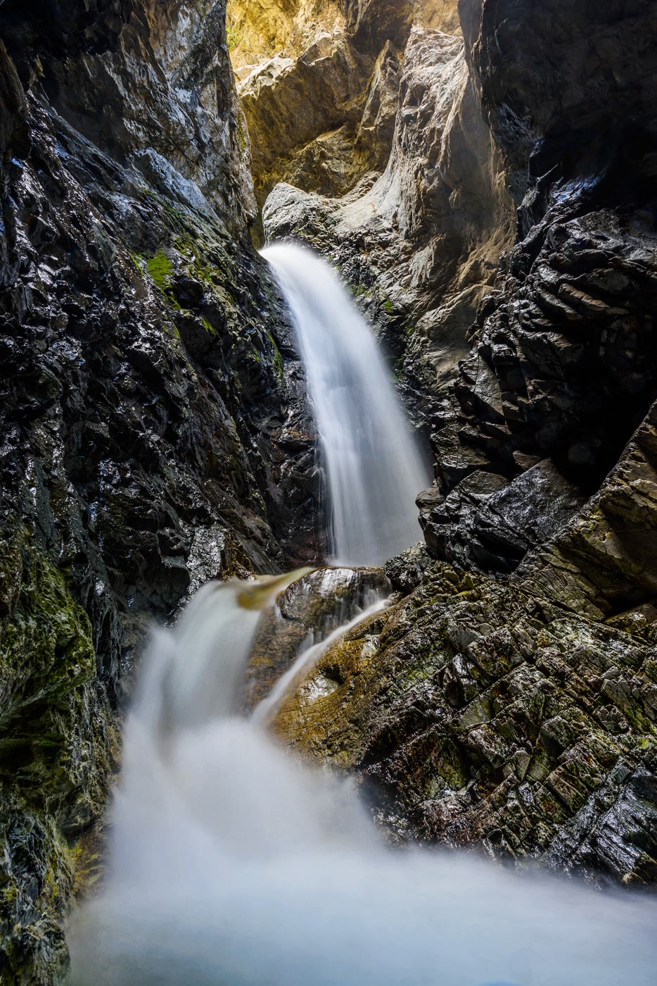Zapata Falls in its dark rock cleft
